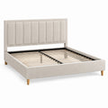 Lit double Rorqelvo 160x200 cm en tissu beige avec tête de lit capitonnée et sommier à lattes.